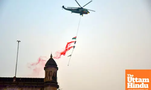 Mumbai: Indian Navy personnel perform stunts during the Navy Day celebrations at Gateway of India