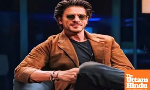 SRK tries to go incognito as he exits jetty with pet and family