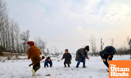 Sopore: Children are seen playing with the snow after a snowfall