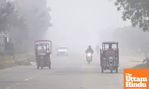 Jaipur: Dense fog engulfs the area as vehicles ply on the road on a cold winter morning