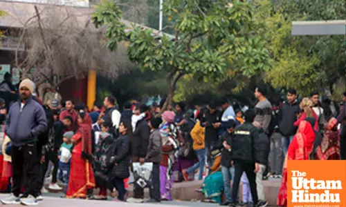New Delhi: People stand in a queue outside Central Secretariat Metro Station