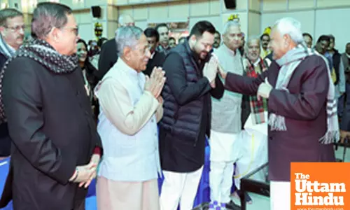 Patna: Bihar CM Nitish Kumar greets RJD leader Tejashwi Yadav during the swearing-in ceremony of Bihar Governor