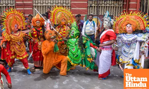 Kolkata: Traditional Purulia Chau artists perform the vibrant Chau dance during the Sara Bangladesh Lokshilpi Samsad protest rally