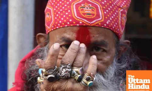Kolkata: A sadhu applies tilak at the Babughat transit camp ahead of the Ganga Sagar Mela