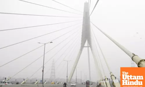 New Delhi: A thick layer of fog engulfs the Signature Bridge