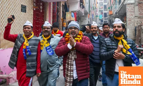 New Delhi: AAP candidate Awadh Ojha conducts door-to-door campaigning at Mandawali