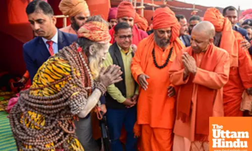 Prayagraj: Uttar Pradesh CM Yogi Adityanath interacts with sadhus