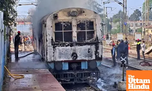 Palamu: Railway workers attempt to extinguish a fire that broke in a railway bogie at Garhwa Road Railway Station