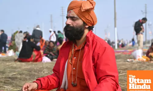 Prayagraj: A devotee meditates on the banks of Sangam