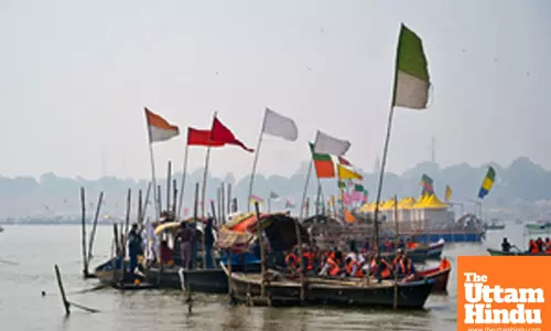 Prayagraj: Devotees take a boat ride at Sangam