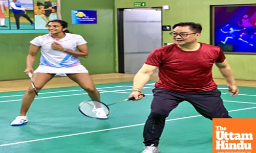 New Delhi: Union Minister Kiren Rijiju plays Badminton along with Badminton player PV Sindhu