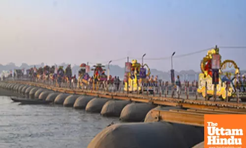 Prayagraj: Sadhus (holy men) take out a religious procession on a pontoon bridge towards the Sangam area