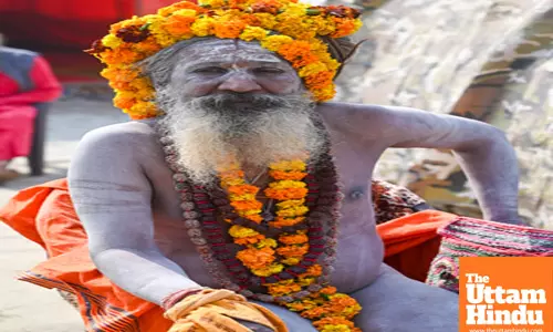 Prayagraj: A Sadhu poses for photos at his camp near the Sangam for the Maha Kumbh Mela 2025
