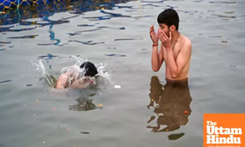 Prayagraj: Devotees take a holy dip in Sangam ahead of the Maha Kumbh Mela 2025