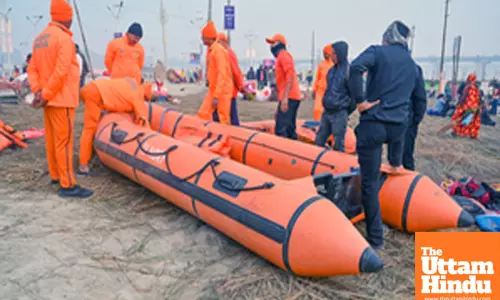 Prayagraj: National Disaster Response Force (NDRF) personnel prepare safety measures along the banks of the Sangam