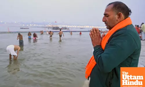 Prayagraj: A devotee offers prayer at the banks of the Sangam