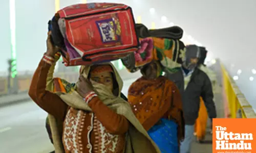 Prayagraj: Devotees arrive to take a holy bath at the banks of the Sangam on the occasion of Paush Purnima