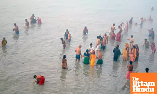 South 24 Parganas: Devotees take a holy dip at Gangasagar Island on a foggy winter morning