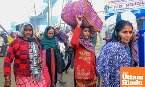South 24 Parganas: Devotees arrive at Gangasagar Island on a foggy winter morning