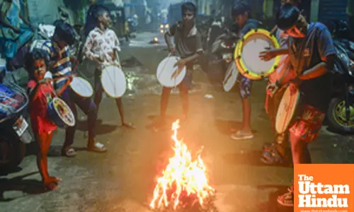 Chennai: Children play drum around the bonfire during the Bhogi celebrations