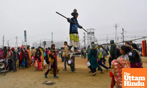Prayagraj: A young girl performs a tightrope act at the banks of Sangam,