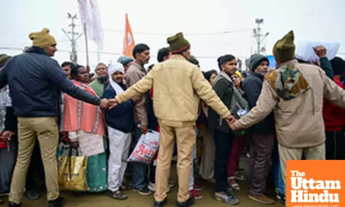 Prayagraj: Police personnel control the crowd at the Triveni Sangam