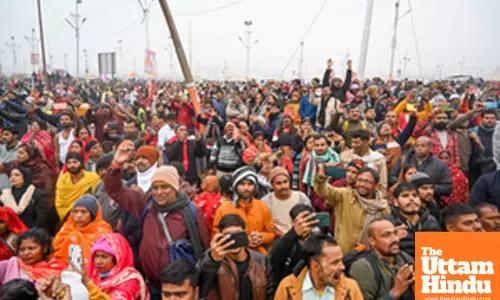 Prayagraj: People gather as Naga Sadhus proceed towards Sangam Ghat for the Amrit Snan (holy bath)