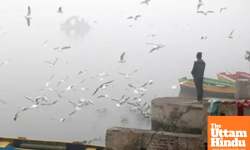 New Delhi: A man stands near Yamuna Ghat amid dense fog on a cold winter morning