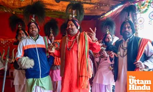 Prayagraj: Jangham Sadhus perform rituals in their camp at the Triveni Sangam