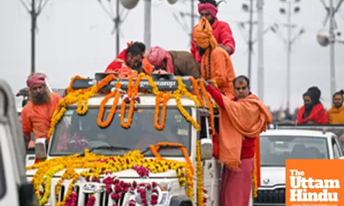 Prayagraj: Sadhus (holy men) arrive to take a holy dip at the Triveni Sangam