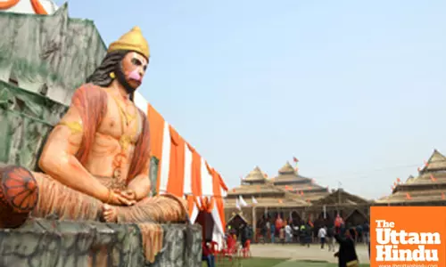 Prayagraj: A statue of Lord Hanuman displayed near decorated pavilions at the Maha Kumbh Mela 2025