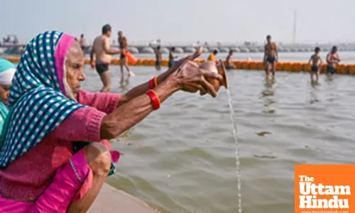 Title : Prayagraj: Devotees perform ritual at the Triveni Sangam