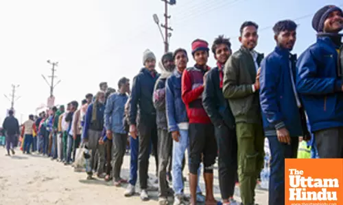 Prayagraj: Devotes in a queue to take Bhojan Prasad (food) at the Triveni Sangam
