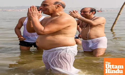 Prayagraj: Defence Minister Rajnath Singh and BJP Rajya Sabha MP Sudhanshu Trivedi take a holy dip at the Triveni Sangam