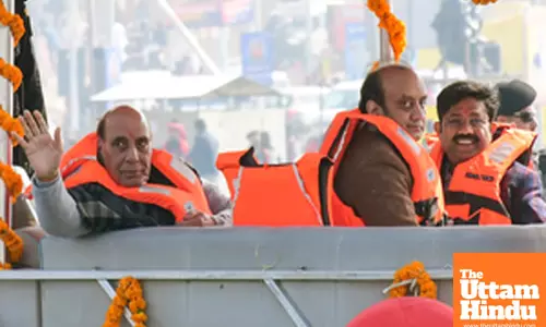 Prayagraj: Defence Minister Rajnath Singh and BJP Rajya Sabha MP Sudhanshu Trivedi take a boat ride at the Triveni Sangam