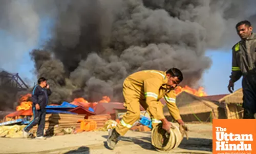 Prayagraj: A firefighter prepares to extinguish a fire that broke out at a camp during the Maha Kumbh Mela 2025