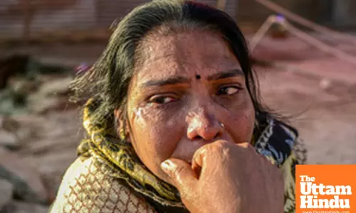 Prayagraj: A woman mourns the loss of her belongings following a fire at a camp during the Maha Kumbh Mela 2025