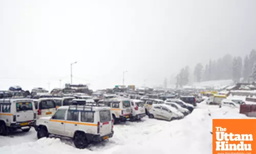 Baramulla: A scenic view of snow-covered taxis
