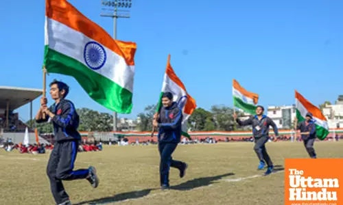 Amritsar: Students rehearse with the Indian national flag for the Republic Day celebrations