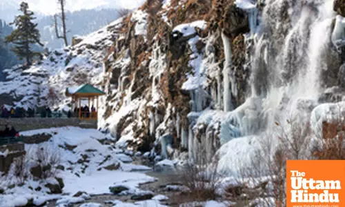 Baramulla: Tourists visit the frozen waterfall in the Drung area of Tangmarg