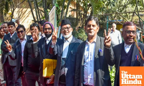 Ranchi: Advocates show victory signs after casting their votes during the Jharkhand State Bar Council Elections