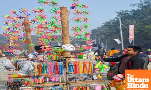 Prayagraj: A man shops from a vendor at the Triveni Sangam during the Maha Kumbh Mela 2025