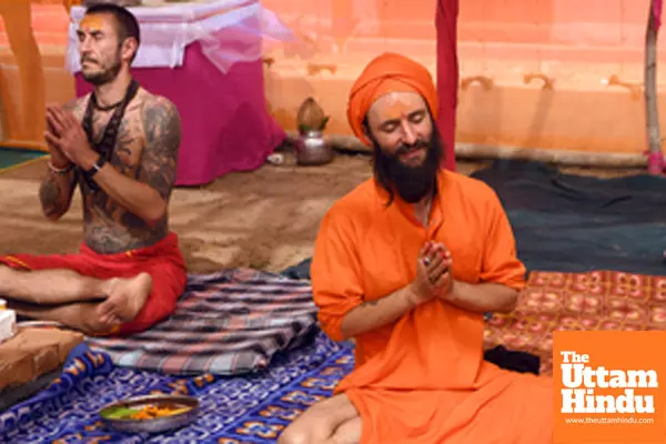Prayagraj: Foreign devotees perform rituals at the Triveni Sangam during the Maha Kumbh Mela 2025 Prayagraj: Foreign devotees perform rituals at the Triveni Sangam during the Maha Kumbh Mela 2025