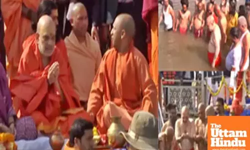 Home Minister Amit Shah takes holy dip in Sangam, CM Yogi accompanies him to ghat