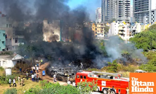 Bengaluru: Fire personnel work to extinguish a blaze that engulfed seized vehicles parked near Jakkarayana Kere