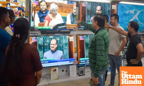 Kolkata: People watch the presentation of the Union Budget 2025