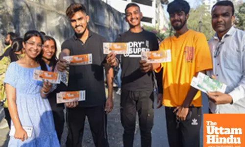 Nagpur: Cricket fans display their tickets for the upcoming ODI match between India and England