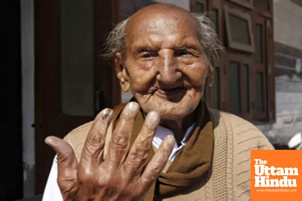 97-year-old Om Parkash Sharma casts his vote for the Delhi Assembly Elections