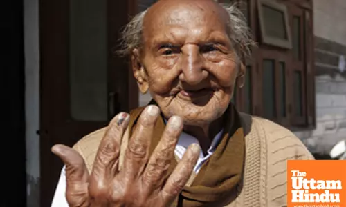 97-year-old Om Parkash Sharma casts his vote for the Delhi Assembly Elections