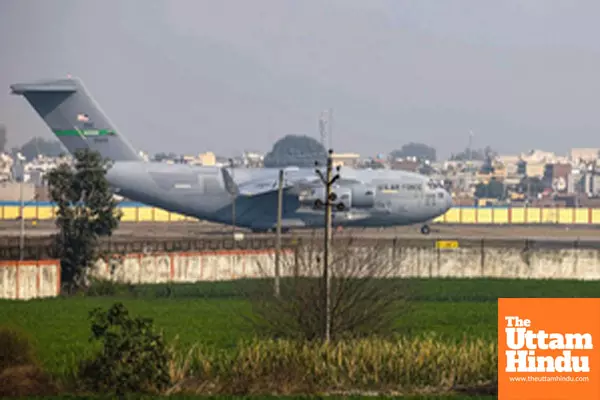 A U.S. military C-17 Globemaster III aircraft, carrying 104 deported Indian nationals lands at Shri Guru Ramdas Ji International Airport